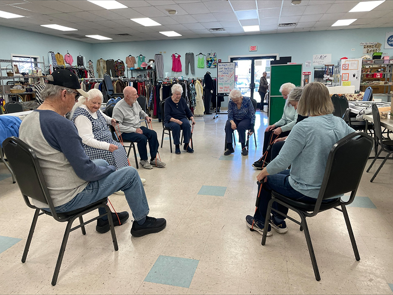Seniors exercise class using tubing.